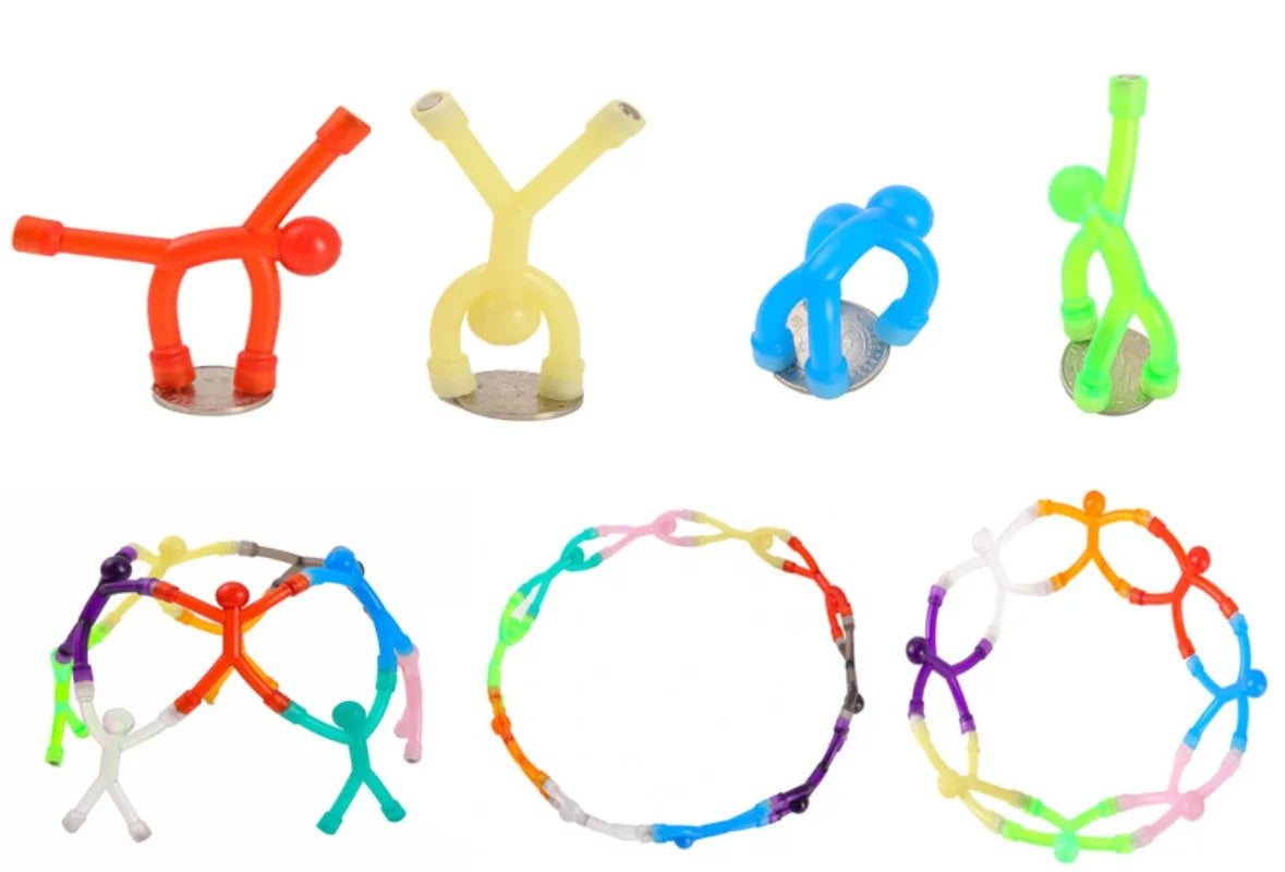 Eine Sammlung magnetischer, humanoider Spielzeuge in verschiedenen Farben und Formen, darunter Strichmännchen und Ringe.
