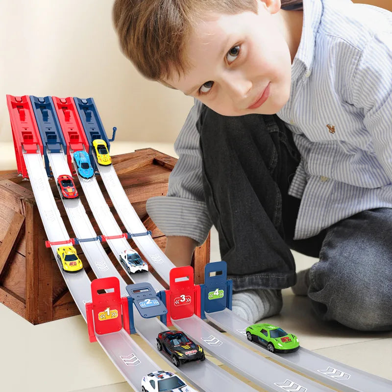 A young boy is playing with a wooden catapult racing car track set featuring various die-cast cars and sliding tracks.