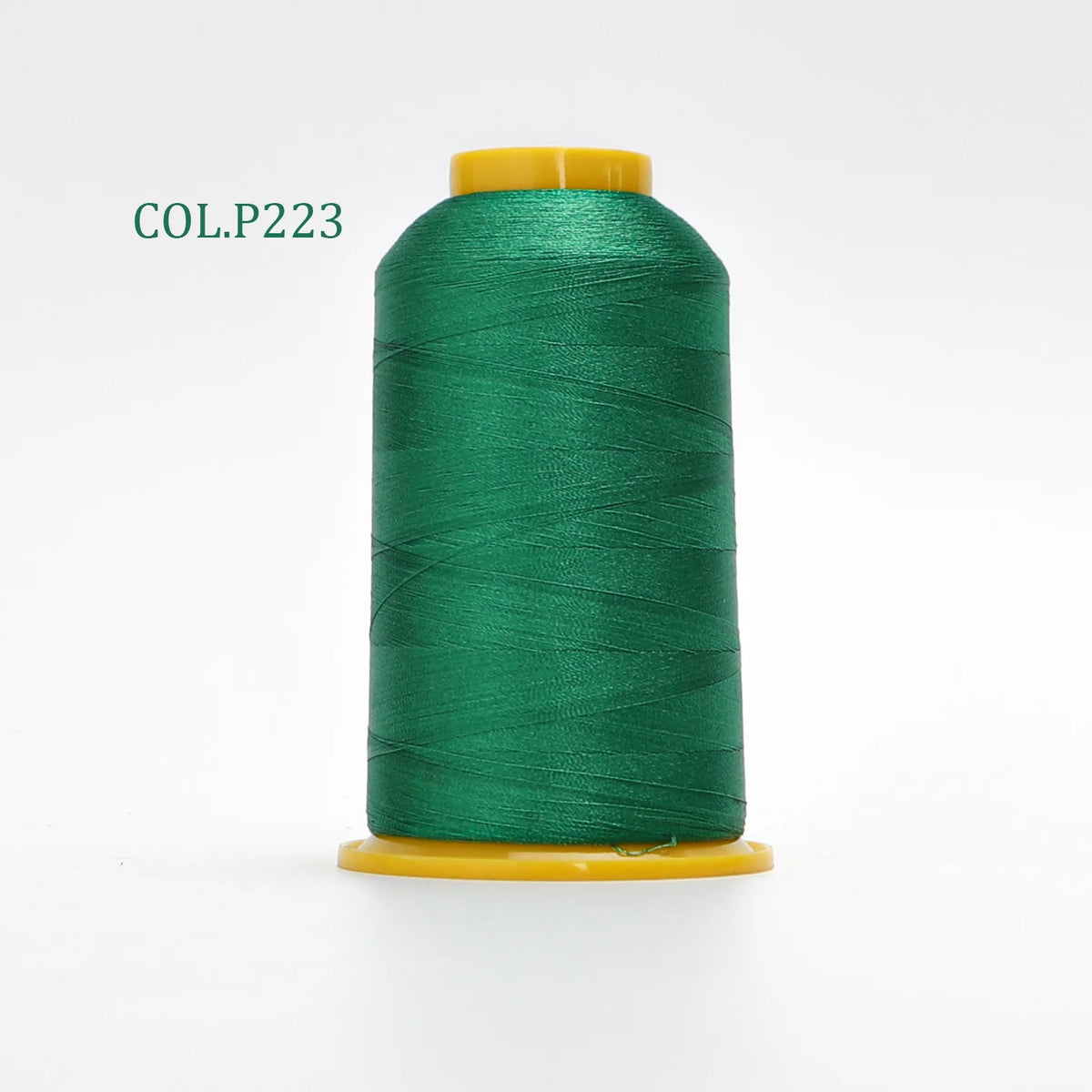 A spool of dark green polyester embroidery thread labeled COL.P223 with a yellow core.
