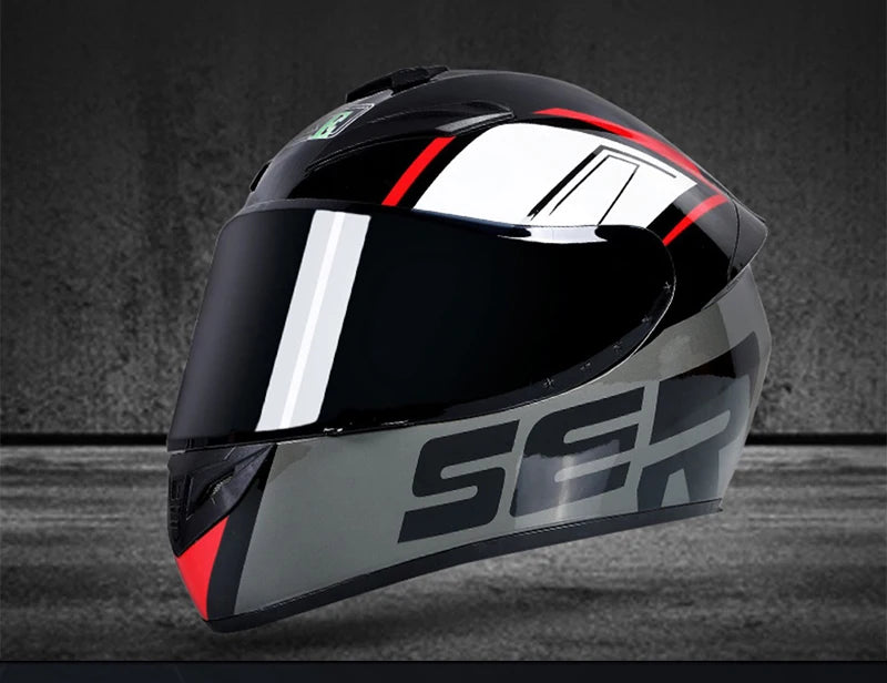 A black and silver full-face motorcycle helmet with red accents shown against a dark background.
