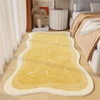 A rectangular yellow plush non-slip decorative area rug placed on a light wooden floor.