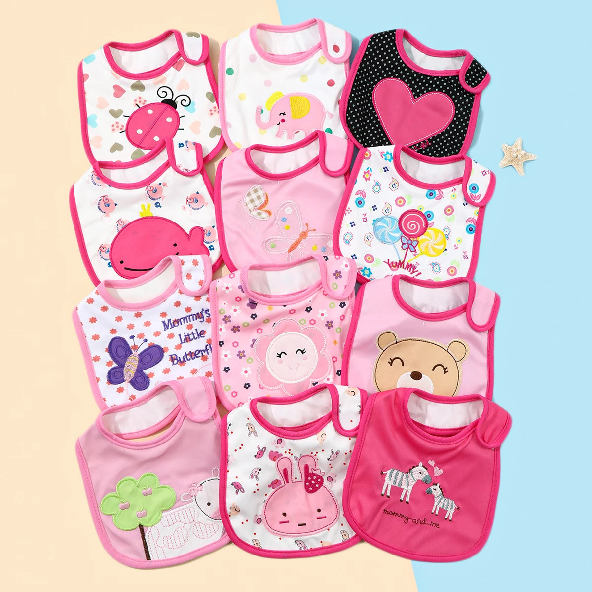 A set of colorful waterproof baby bibs and burp cloths featuring various cartoon prints for babies.