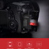A close-up of a SanDisk Ultra microSD adapter and card inserted into a camera or device.