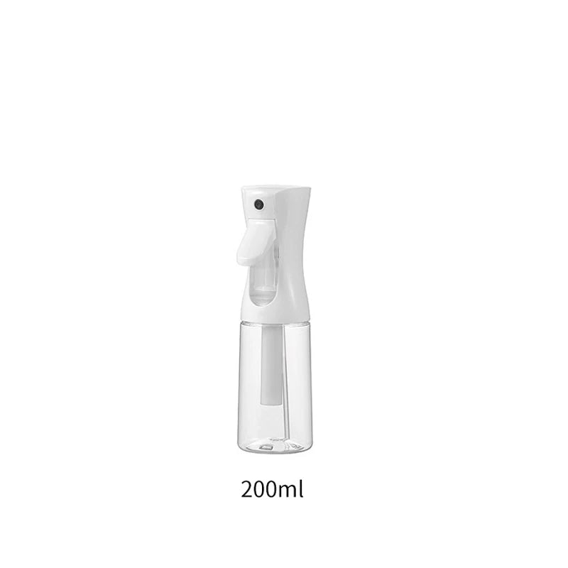 A clear, refillable fine mist continuous spray bottle with a white pump dispenser.