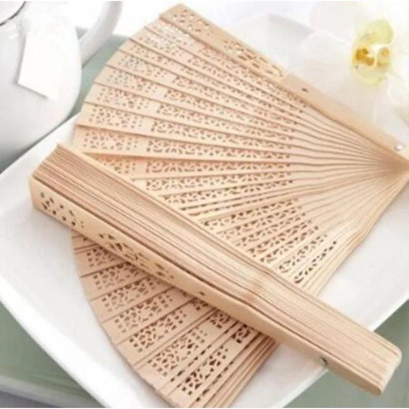 Handcrafted Sandalwood Folding Fan with Intricate Cutwork