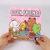 A pink coloring book titled Cozy Friends Cute & Comfy Coloring Book featuring cute animal characters like a bear and a yellow