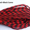 Red and black camo paracord rope coiled for camping and climbing