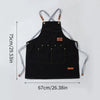 Black canvas kitchen apron with gray straps and large pockets