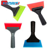 A set of automotive film application tools including a black squeegee and various colored rubber scrapers.