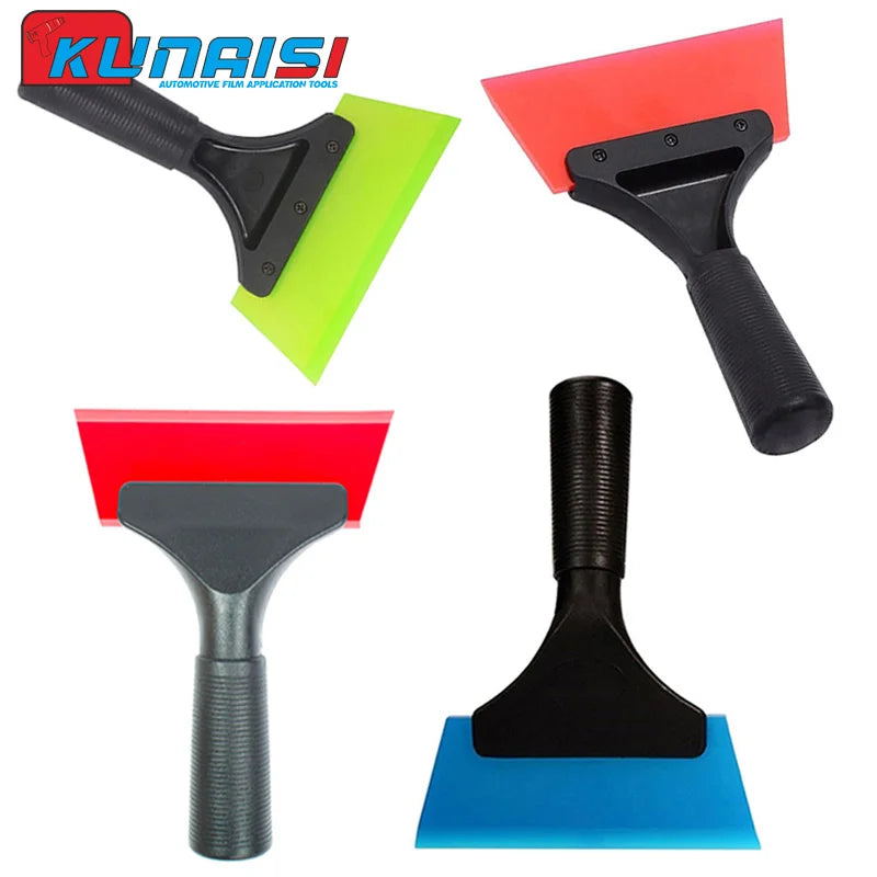 A set of automotive film application tools including a black squeegee and various colored rubber scrapers.