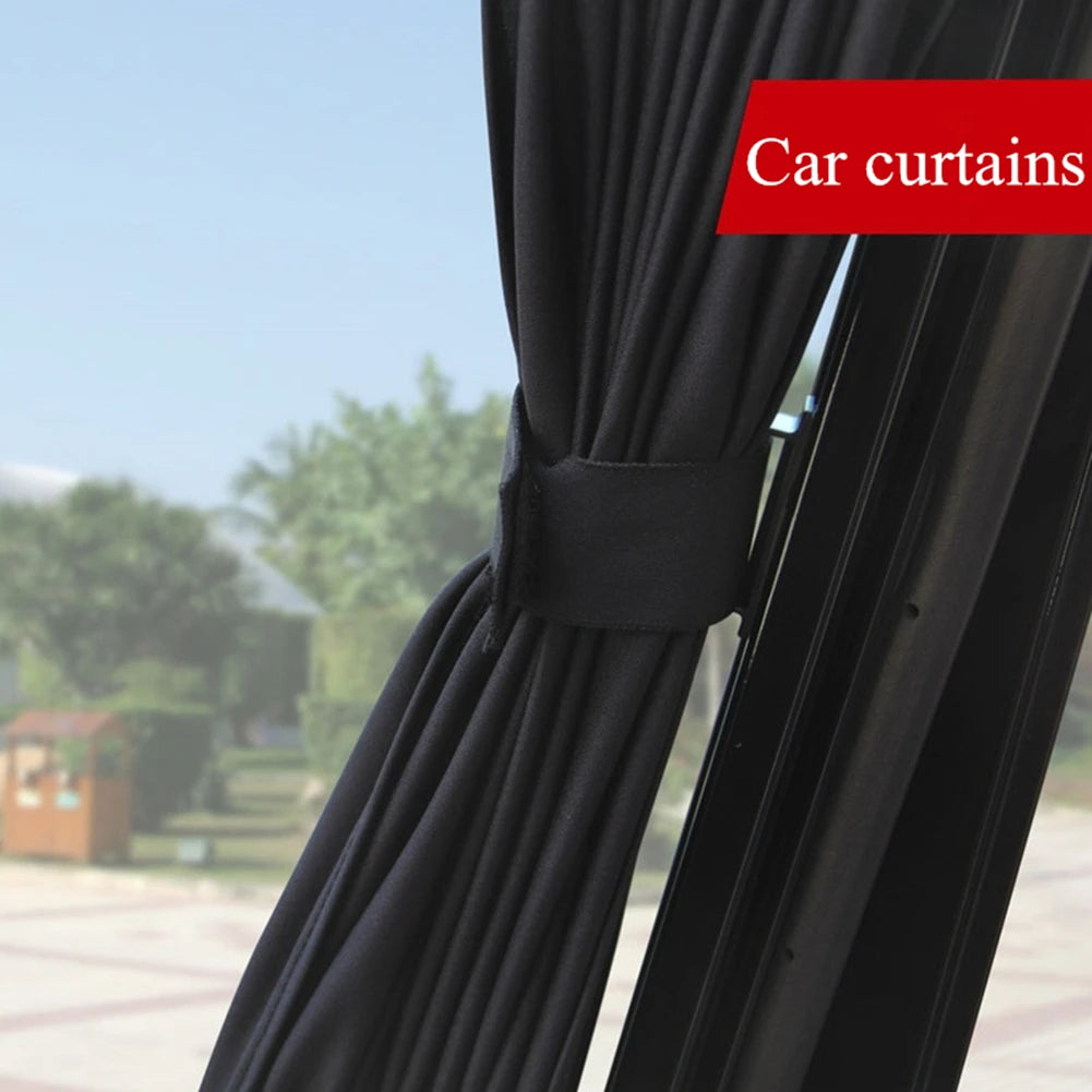 Black car curtains or side window sun shades shown in a close-up view.