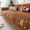 Brown Christmas tree chenille sofa covers with gold and red snowflake embroidery on a sofa.