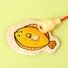 A wooden magnetic fishing game toy shaped like a yellow fish with an attached string.