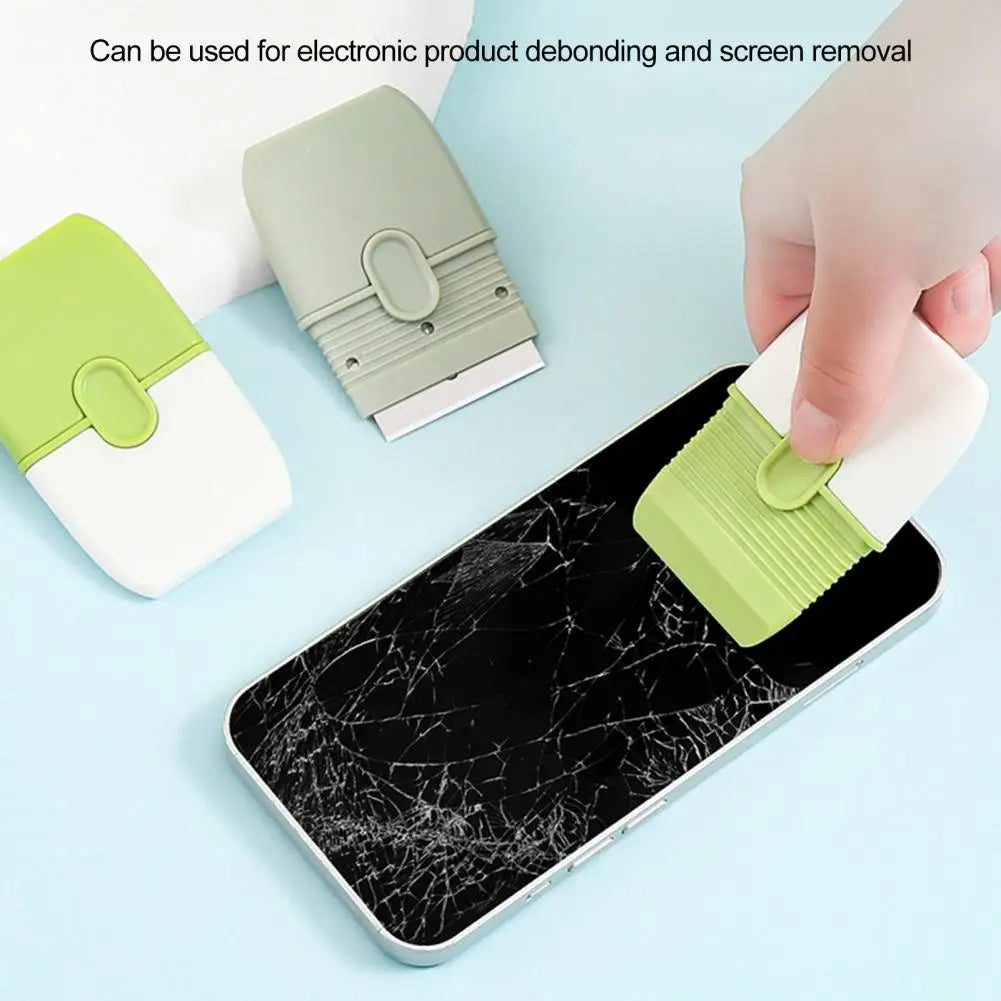 A hand is using a green double-ended cleaning scraper with a protective cover to remove a screen from a smartphone.