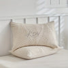 A beige microfiber duvet cover featuring an embossed leaf pattern resting on a white surface.