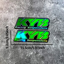 Two neon green and blue KYB Racing Suspensions stickers displayed against a gray textured background.