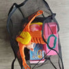 A breathable mesh tote bag filled with various small toys and accessories.