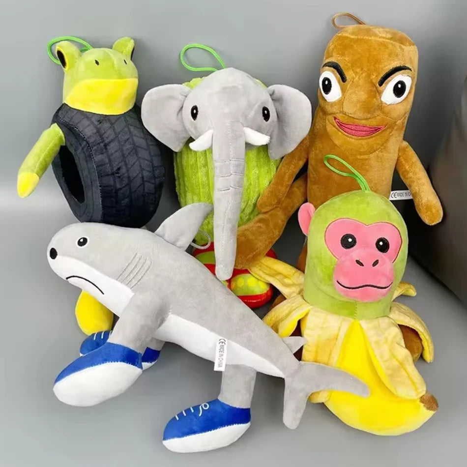 A collection of plush toys featuring various animals including a shark, an elephant, a monkey, and a lemur.