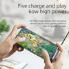 A hand holds a smartphone displaying text about five charge and play 6ow high power features.