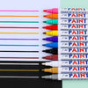 A collection of various colored paint markers and touch-up pens lined up on a white surface.