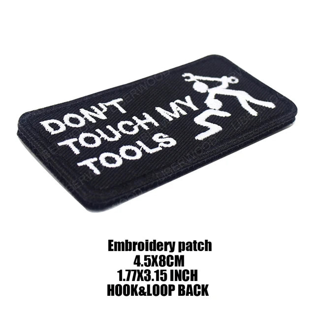 Black embroidered patch with white text that reads DON'T TOUCH MY TOOLS