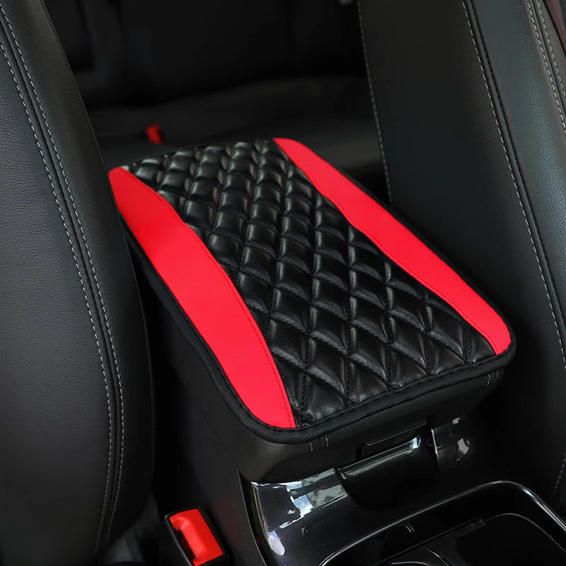 Black and red quilted PU car armrest cover with storage pad shown inside a vehicle interior.