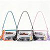 Three clear PVC shoulder bags in teal, black, and pink with adjustable straps.