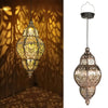 A detailed view of a solar-powered Moroccan lantern with intricate waterproof ironwork design.