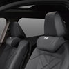 Close-up view of a black leather car seat headrest neck pillow with soft touch and flexible design.