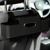 A black backseat car organizer with cup holders and hooks mounted on a car seat.