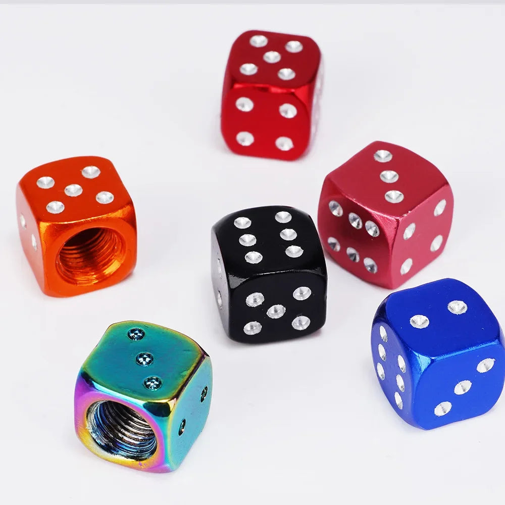 A set of four aluminum alloy dice with various colors including red, black, and blue.