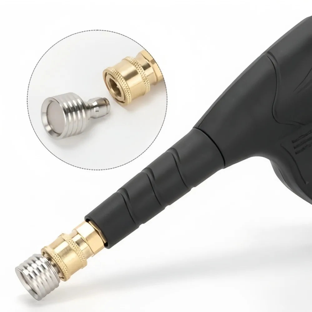 Close-up view of a stainless steel high-pressure washer nozzle with a 1/4 quick connect fitting.