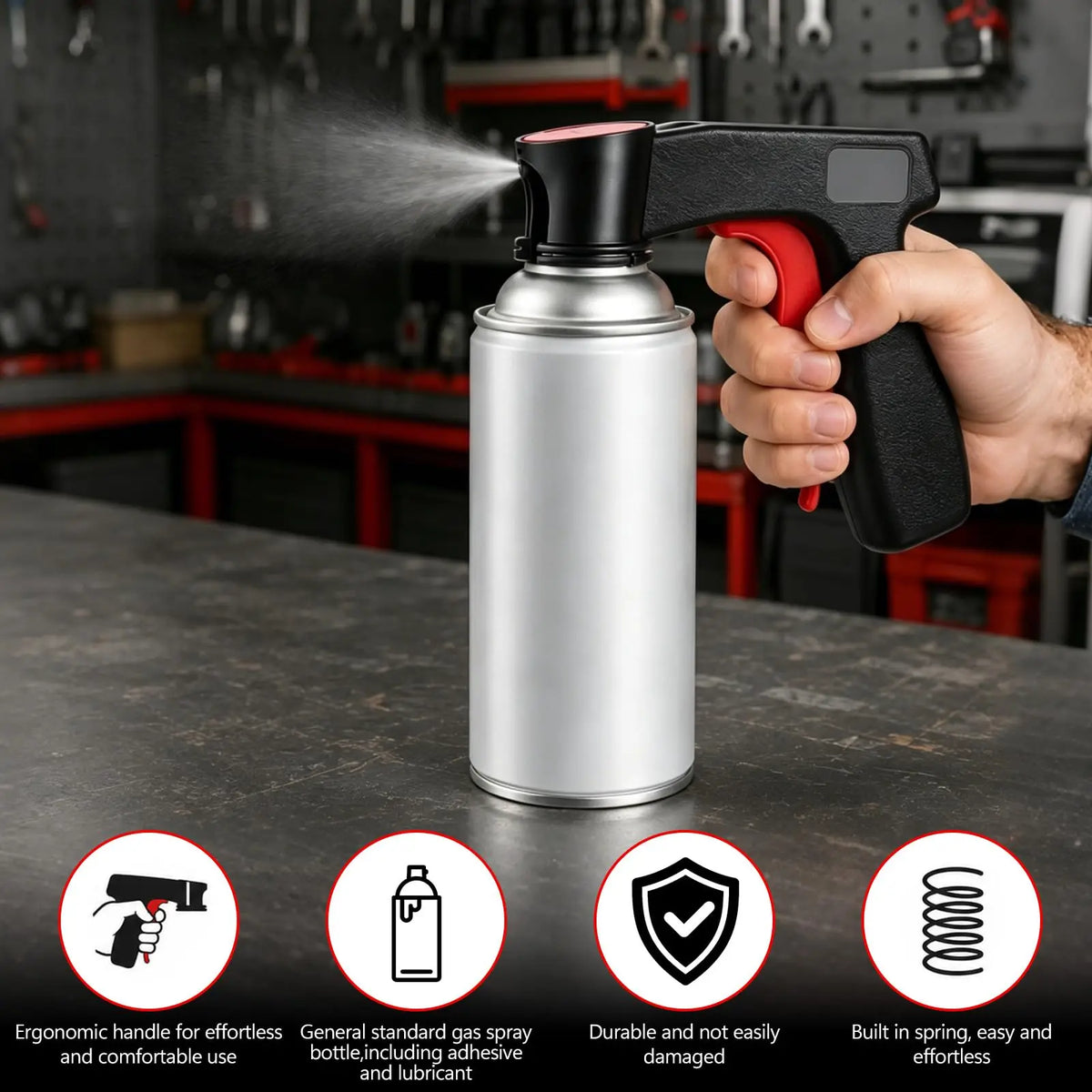 A hand holds a silver aerosol spray can with a black handle, demonstrating its ergonomic design.