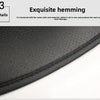 Close-up view of a black car seat cover showing exquisite hemming detail.