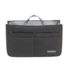 A black purse organizer insert with multiple compartments and a handle.