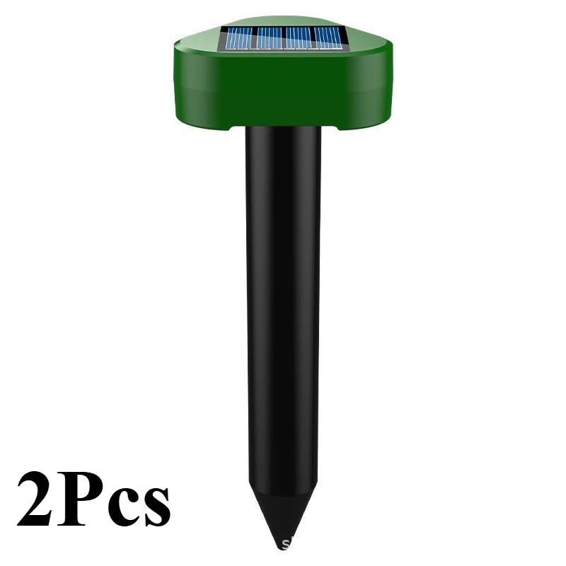 Two green and black solar-powered ultrasonic animal repellent devices.