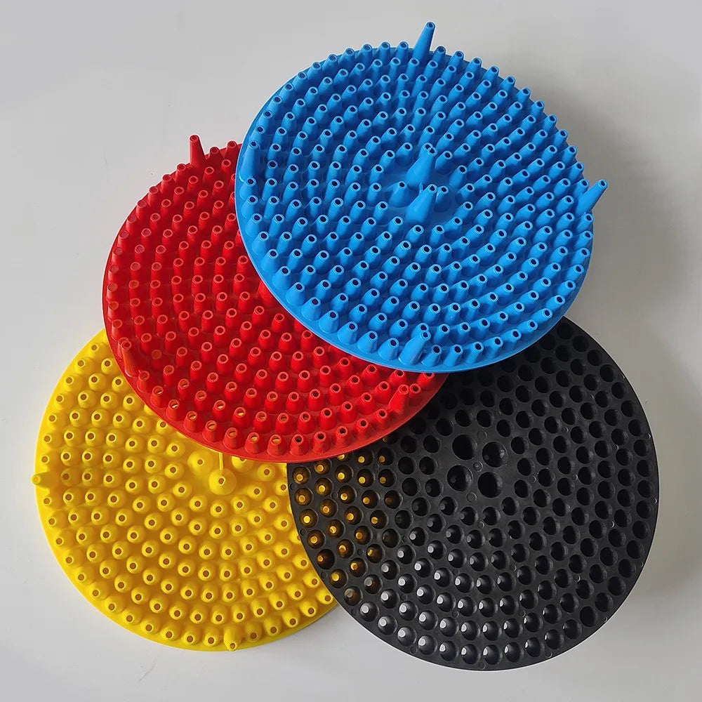 A collection of five colored car wash bucket grit guard inserts, including blue, red, yellow, and black.