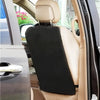 A black back kick protector installed on the rear seat of a car, visible through the window.