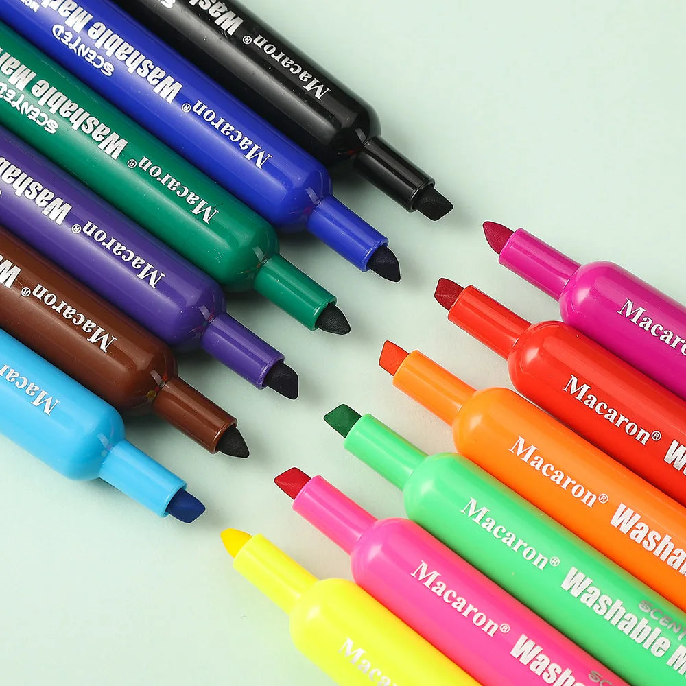 A collection of 12 assorted washable scented markers in various fruit colors, including green, purple, blue, and yellow.