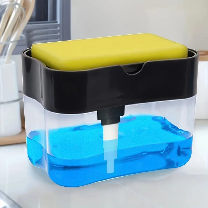 A clear plastic soap dispenser with a black lid and a yellow sponge holder filled with blue liquid.