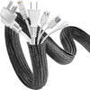 Black braided cable sleeve with multiple connectors for desk and home organization