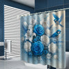 A light blue floral shower curtain featuring blue roses, white flowers, and blue foliage.