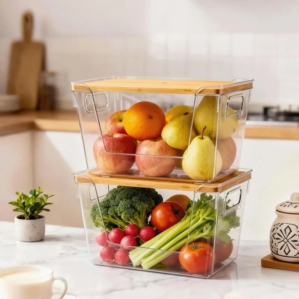 Stackable clear pantry storage bins with bamboo lids filled with fresh produce like apples and tomatoes