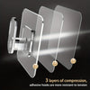 Three layers of compression adhesive hooks demonstrating resistance to tension.