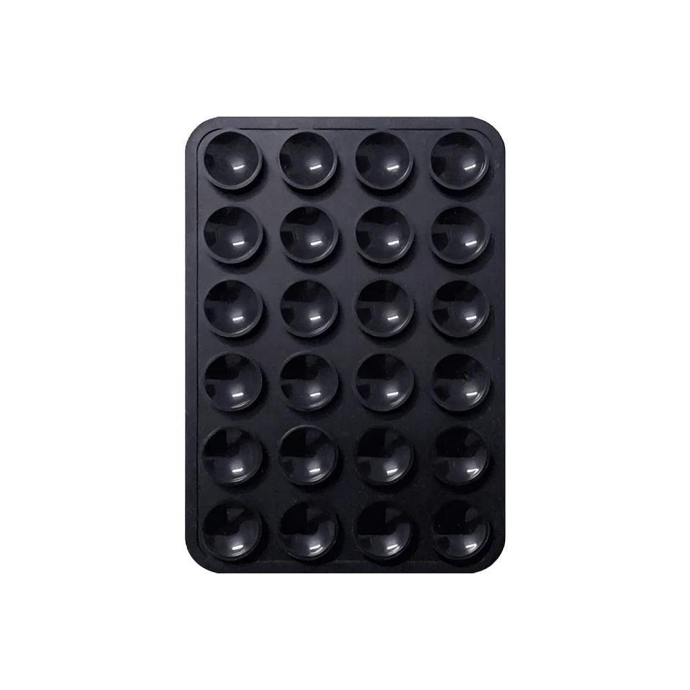 Black silicone suction pad with multiple circular holes for phone mounts
