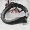 Black ergonomic grocery bag carrier with a soft-grip handle shown against a white background.