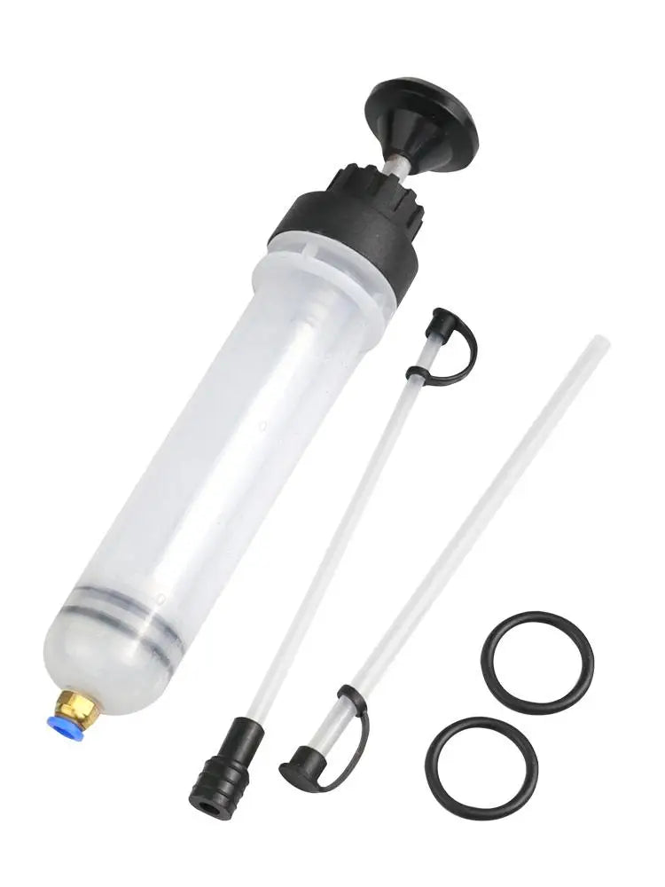 A clear plastic manual fluid transfer syringe pump with a black plunger and a long glass rod for automotive fluid work.