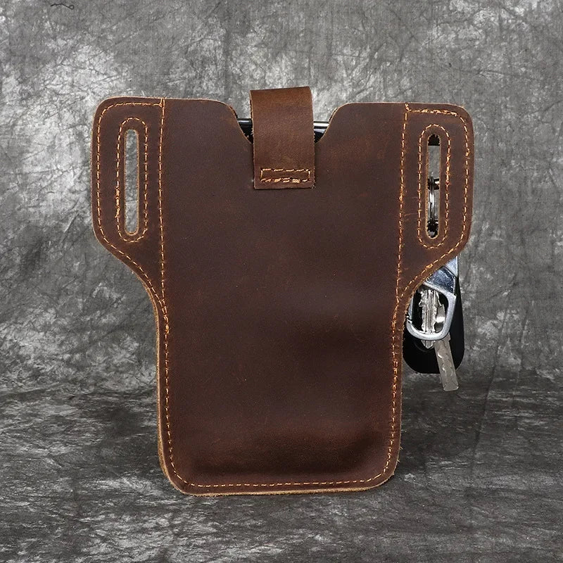 A brown genuine leather waist bag with multiple pockets and a strap is shown against a dark gray background.