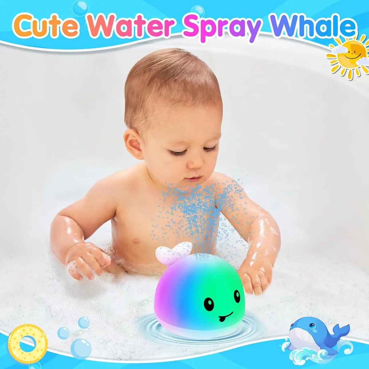 A baby is playing with a light-up whale bath toy that sprays water in a bathtub.