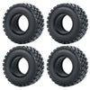 Four black soft rubber tires for 1/18 and 1/24 RC crawler cars shown from the top view.